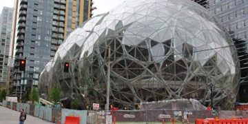 Online retail powerhouse Amazon is constructing an eye-catching Spheres office building to feature waterfalls, tropical gardens and other links to nature as part of its urban campus on May 11, 2017 in downtown Seattle, Washington.  / AFP PHOTO / Glenn CHAPMAN        (Photo credit should read GLENN CHAPMAN/AFP/Getty Images)