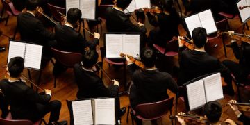 Orchestra (Photo by Samuel Sianipar on Unsplash)